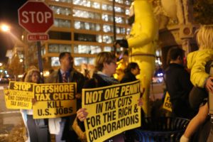 Tax prom protesters march with signs