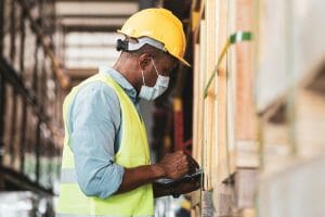 Black worker doing inventory