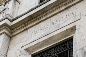 Inscription on a marble building that reads "Federal Reserve"