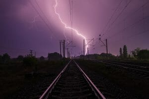 Lightning over a railway track.