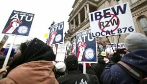 LANSING, MI, - DECEMBER 11: Union members from around the country rally at the Michigan State Capitol to protest a vote on Right-to-Work legislation December 11, 2012 in Lansing, Michigan. Republicans control the Michigan House of Representatives, and Michigan Gov. Rick Snyder has said he will sign the bill if it is passed. The new law would make requiring financial support of a union as a condition of employment illegal. (Photo by Bill Pugliano/Getty Images)