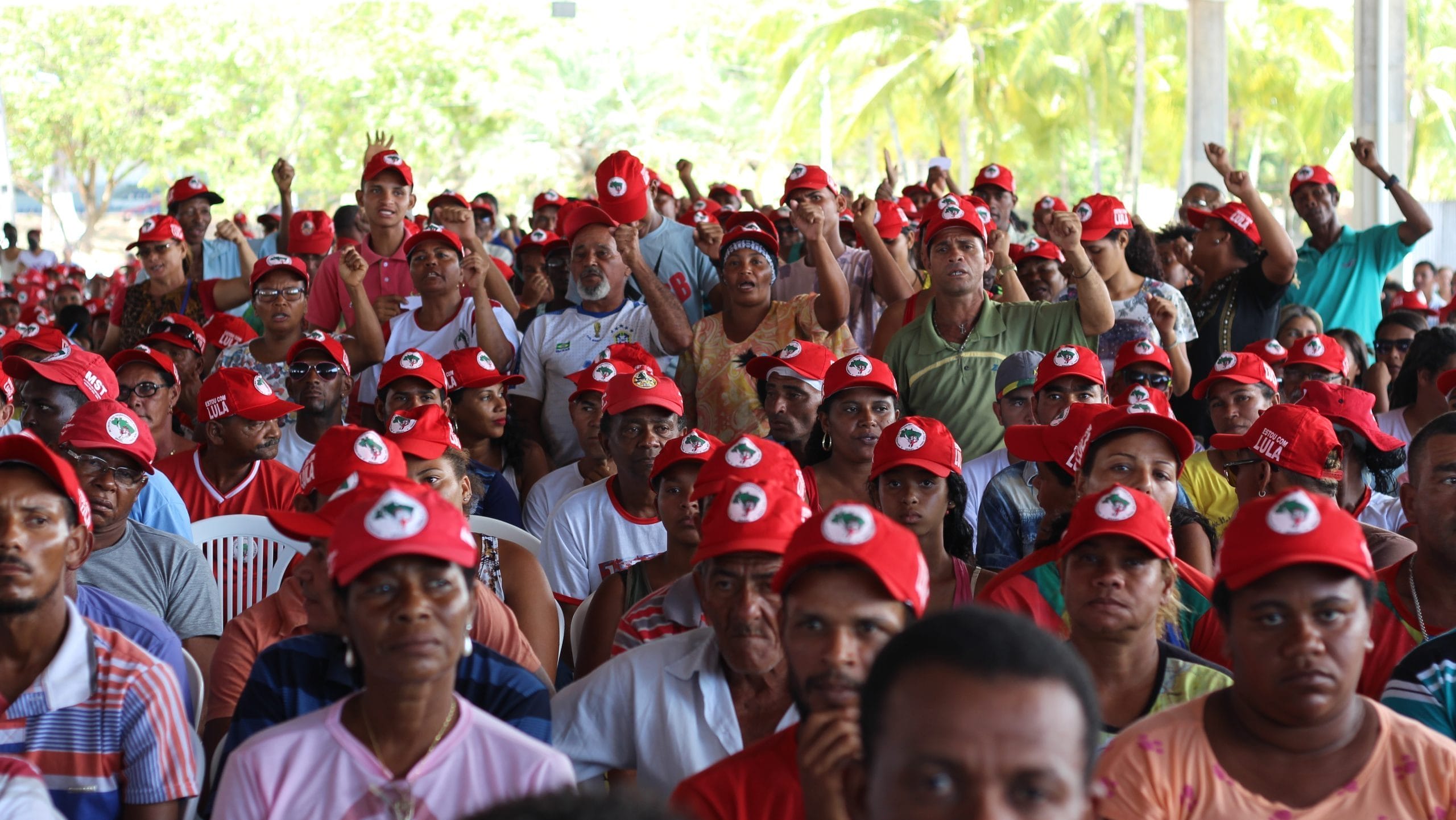 Members of the MST in matching red hats