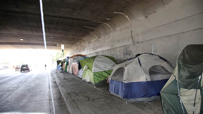 Tents under a bridge