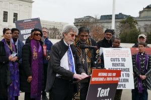 A man speaks into a microphone