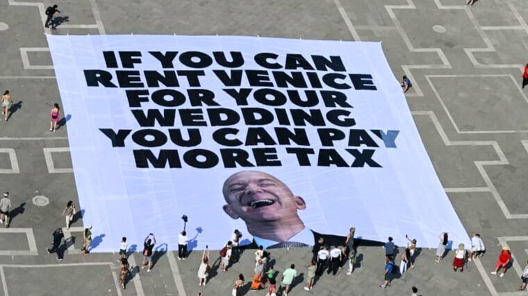 Jeff Bezos sign on the ground in Venice